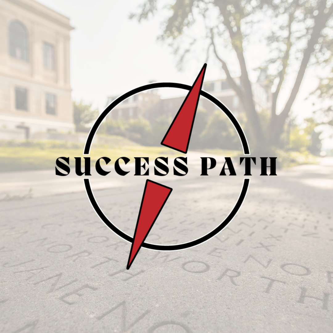 a compass graphic with a red needle and text that reads "Success Path" on top of a pathway with engraved names